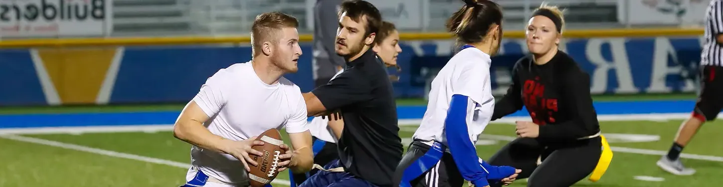 Students playing intramural football